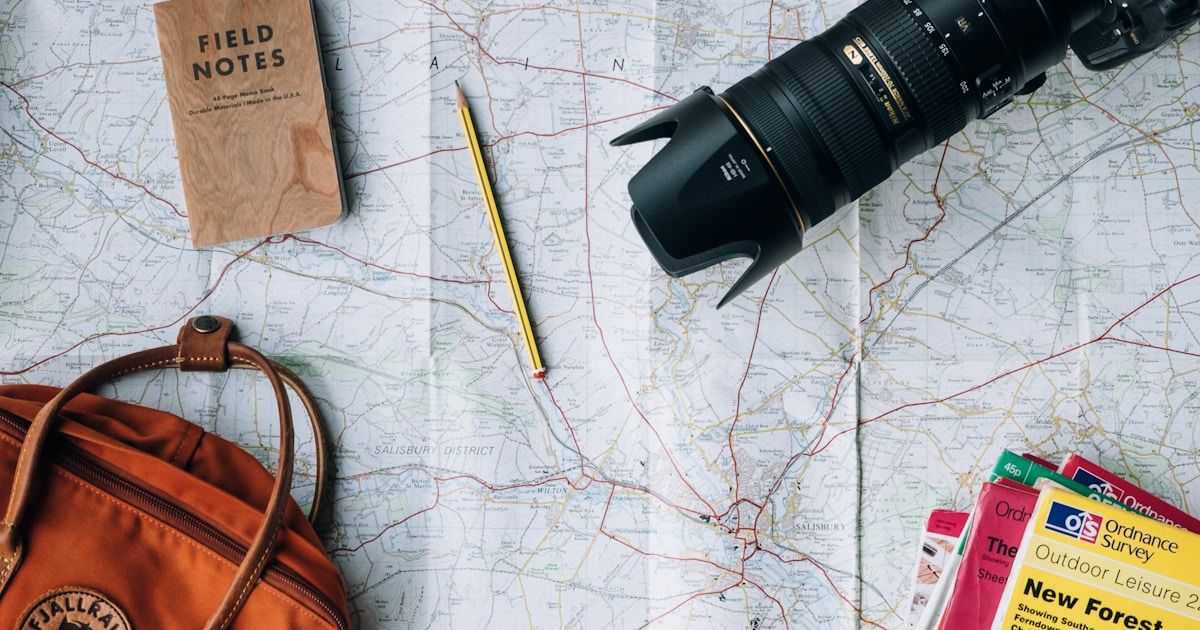 World map with passports and travel items - travel planning for Dutch passport holders abroad